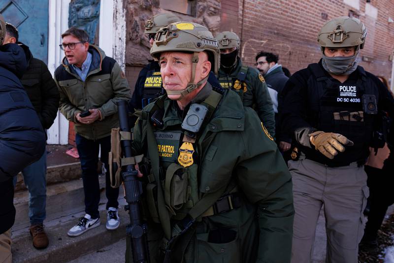 Border Patrol Cmdr. Gregory Bovino walks alongside his agents after they detain an individual near West 27th Street and South Ridgeway Avenue in the Little Village neighborhood of Chicago, Tuesday, Dec. 16, 2025.