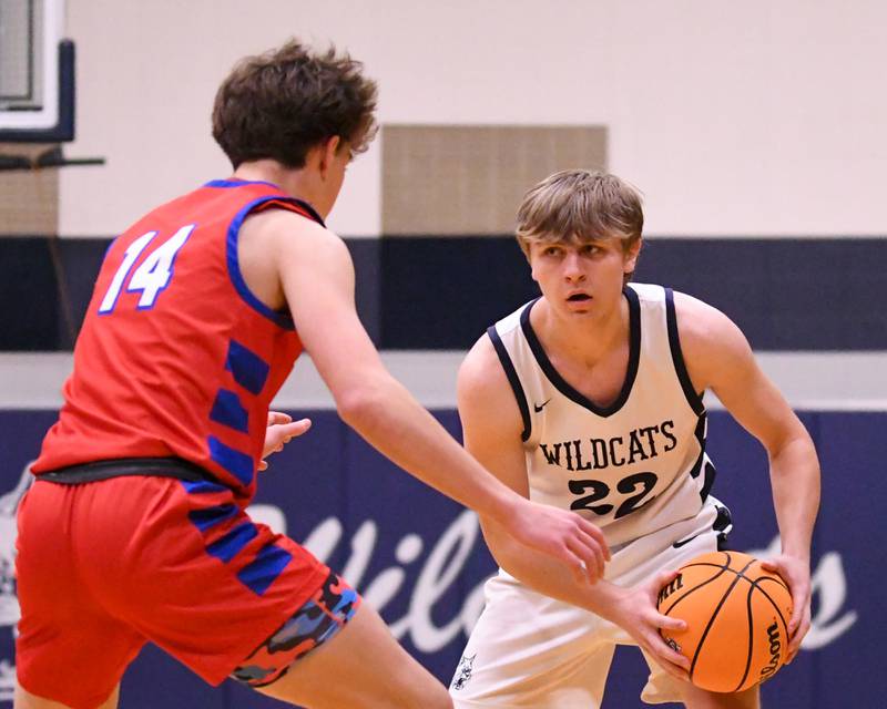 West Chicago's Tommy Doyle (22) looks for an open teammate while being defended by Glenbard South's Cooper Langreder (14) during the game on Friday Jan. 3, 2025, held at West Chicago High School.