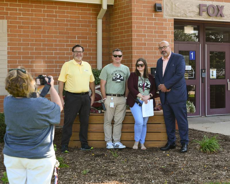 School board member Dominick Cirrone, left, Fox Chase elementary principal Jeff Renaldi, Vice principal Amy Steves and Oswego school board superintendent Andalid Khelghati all pose for a photo outside Fox Chase Elementary after welcoming students back to school on the first day of classes held on Wednesday Aug. 16, 2023.