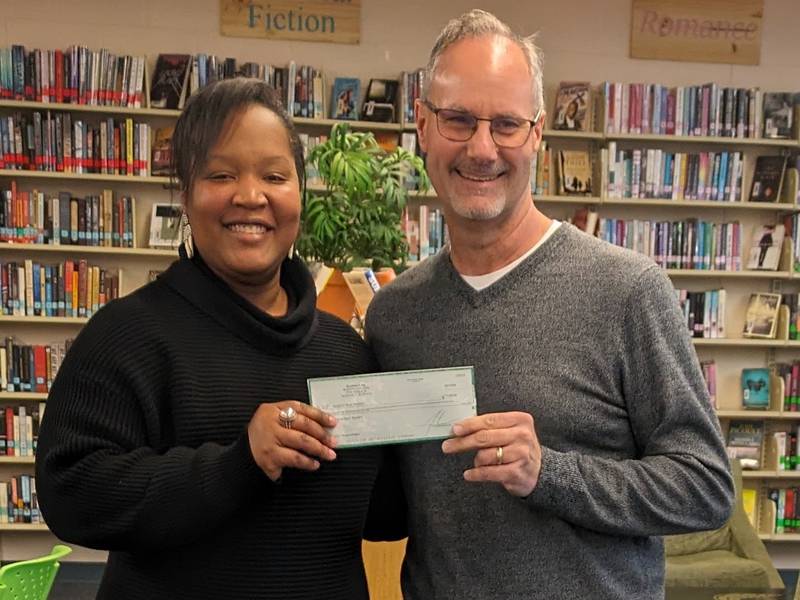 (From left) Jenelle Robers, president of the Sycamore Music Boosters and Jon Bockman, owner of Bockman’s Auto, Truck and Tire’s.