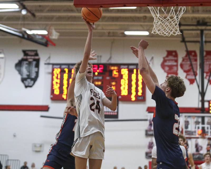 Yorkville's Nathan Kubin (24) puts up a shot at the basket during their basketball game between Oswego at Yorkville Friday, Dec 12, 2025 in Yorkville.