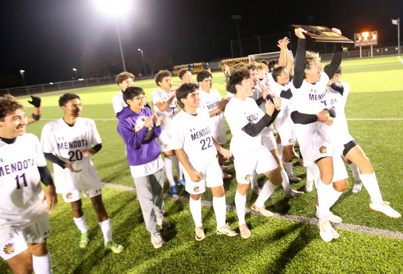 Members of the Mendota soccer team hoist the Class 1A Sectional trophy after defeating Peoria Christian on Wednesday, Oct. 30, 2024 at Chillicothe High School.
