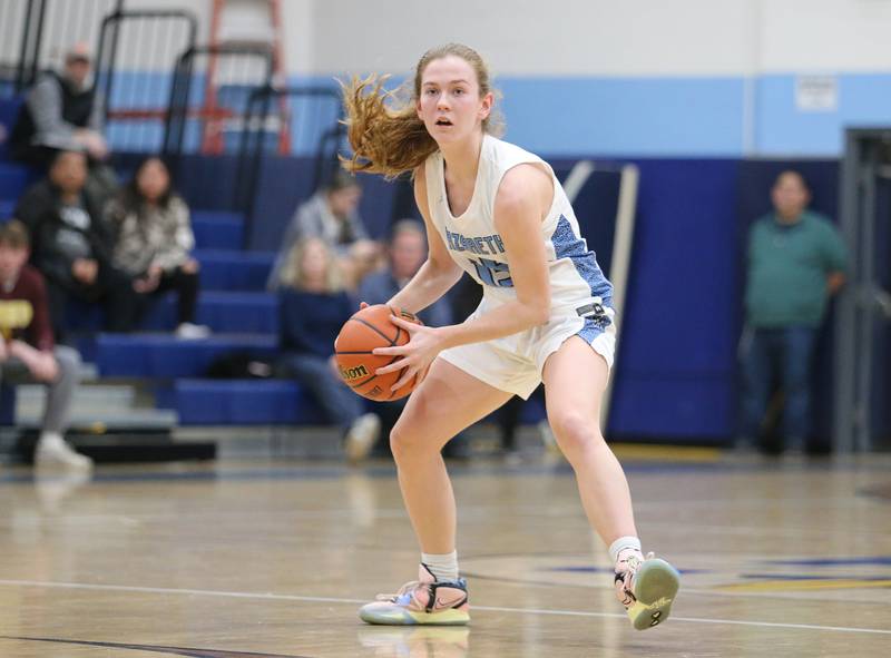 Nazareth's Mary Bridget Wilson (15) looks to pass during the girls varsity basketball game between Fremd and Nazareth on Monday, Jan. 9, 2023 in La Grange Park, IL.