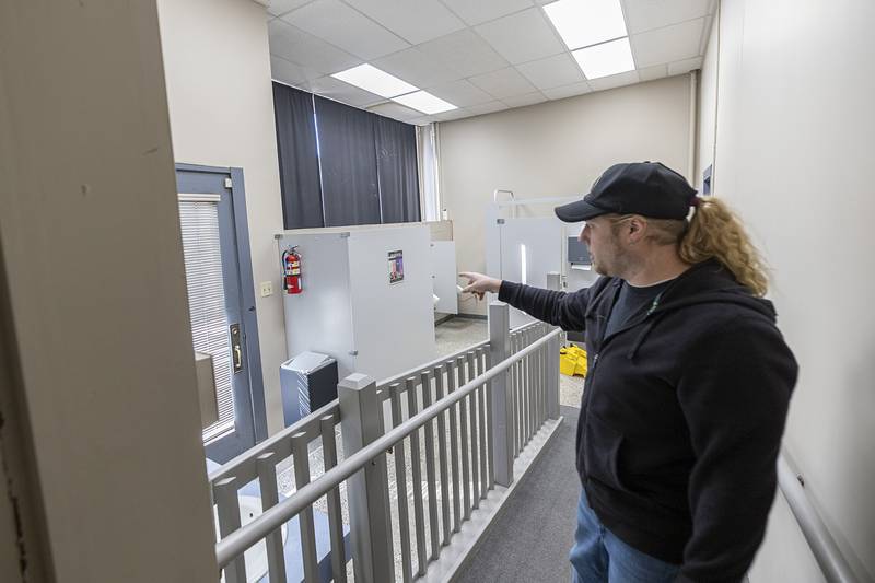 Shipp points out improvements to the men’s bathroom Wednesday, March 6, 2024. The ramp will be elongated and fixtures rearranged.