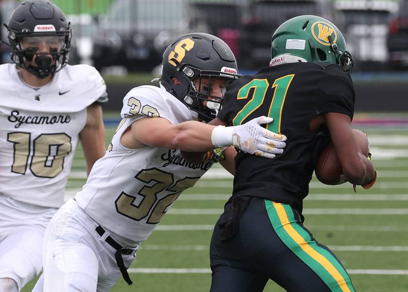 Sycamore's Landon Egler brings down Westinghouse's Jaidyn Gandy Saturday, Nov. 9, 2024 during their Class 5A second-round playoff game at Knute Rockne Stadium in Chicago.