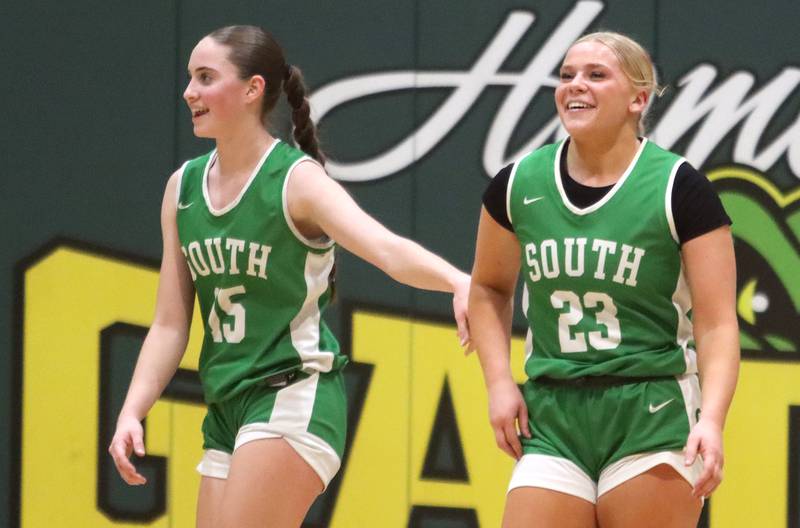 Crystal Lake South’s Tessa Melhuish, left, encourages teammate Laken LePage, right, during a loss to Kaneland in IHSA Class 3A Regional Title Game girls basketball action on Friday, Feb. 21, 2025, at Crystal Lake South High School in Crystal Lake.