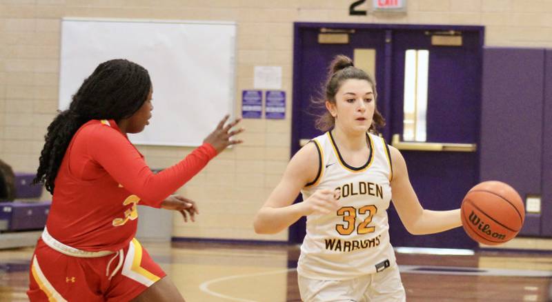 Sterling's Maggie Rowzee (32) drives on Rockford Jefferson's Mo'rya Mitchell on Wednesday at the Dixon KSB Holiday Classic. Jefferson won 41-37.
