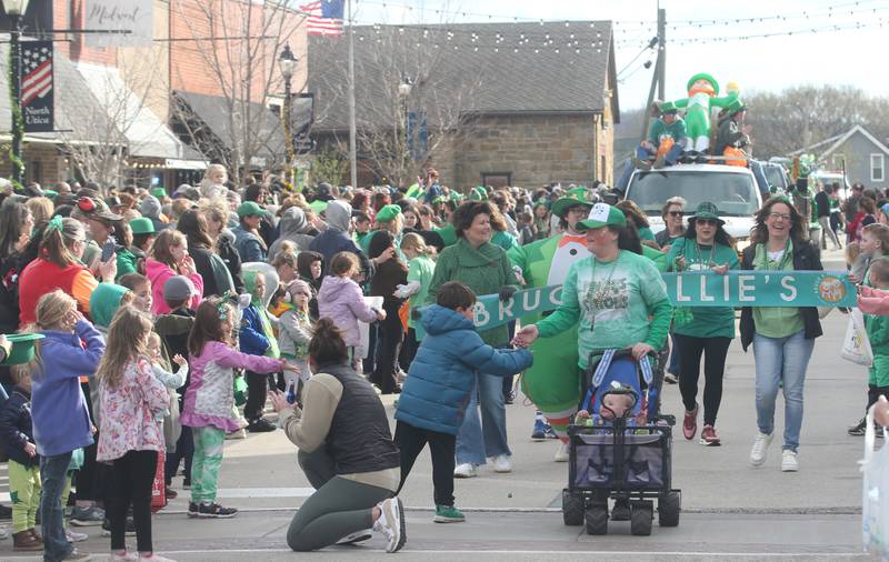 Bruce and Ollies workers walk during the St. Patrick's Day parade on Saturday, March 16, 2024 downtown Utica.