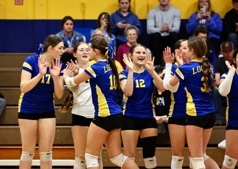 Annabelle's Schlender and the Princeton Logan Lionesses celebrate their regional quarterfinal victory Saturday at Pannebaker Gym.