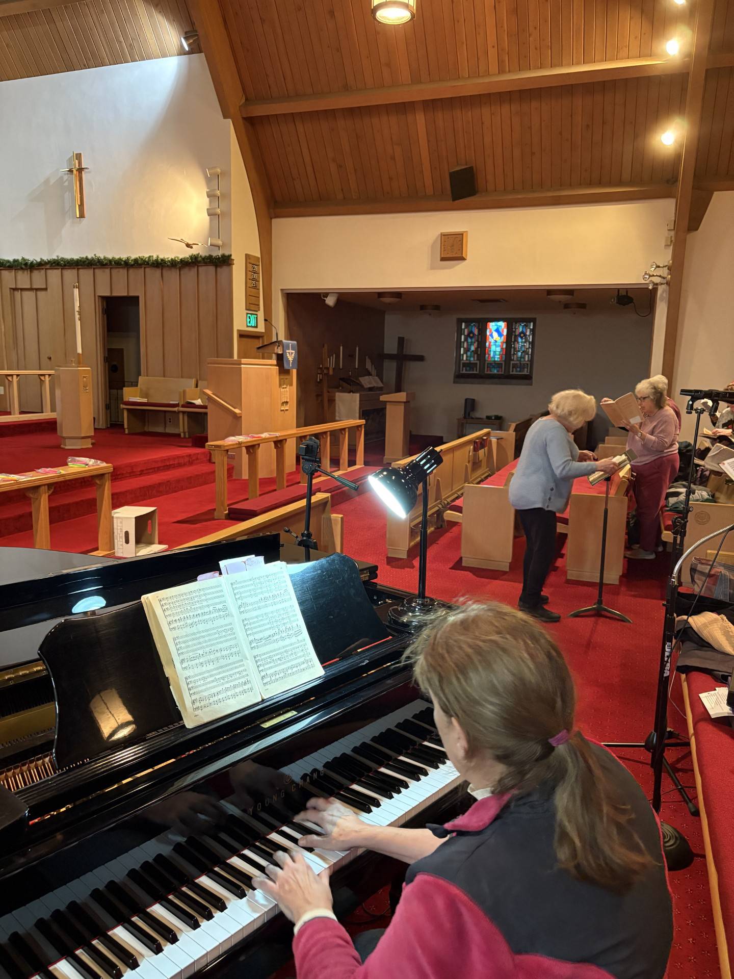 A pianist accompanies the Streator community choir during rehearsal for their performance of Handel’s Messiah at St. Paul Lutheran Church on Sunday afternoon.