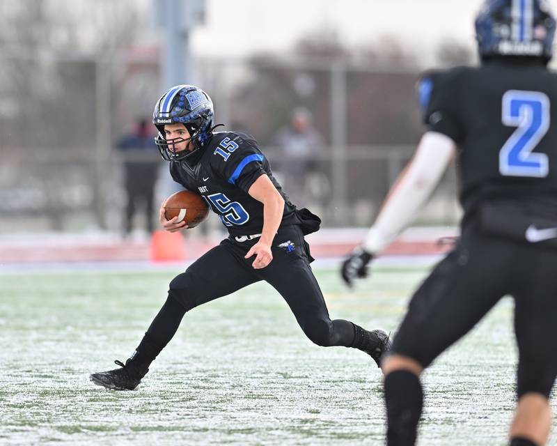 Lincoln-Way East's Braden Tischer (15) attempts to gain positive yards during the IHSA Class 8A Semifinals on Saturday, November 19, 2022, at Frankfort.