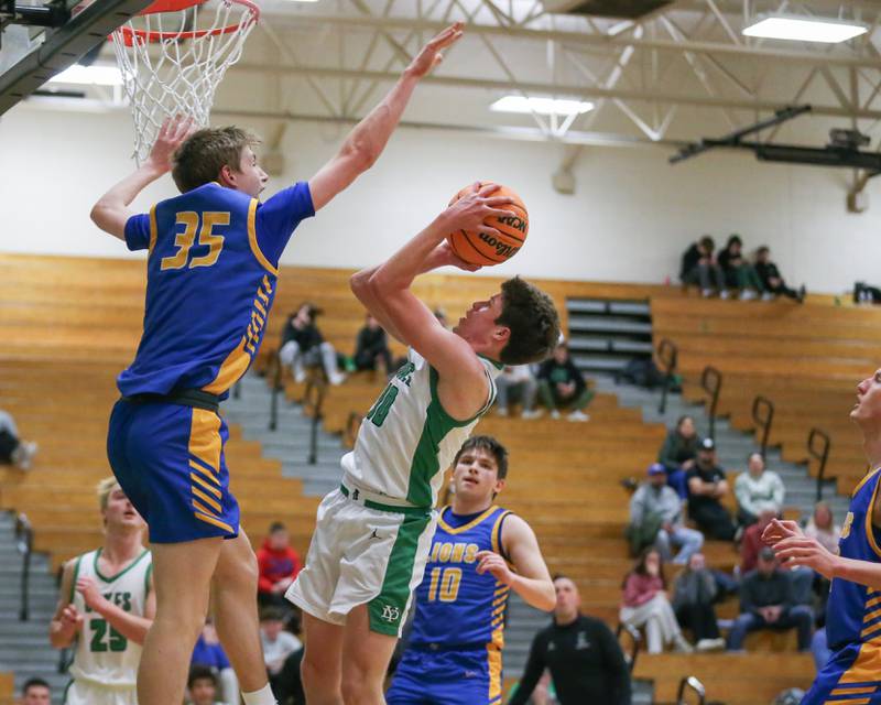 York's Brendan Carroll (10) puts up a contested shot during their basketball game between Lyons at York. Jan 10, 2025 in Elmhurst.