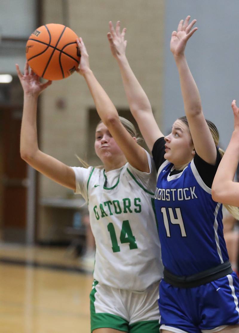 Crystal Lake South's Makena Cleary grabs a pass in front of Woodstock's Reese Zawisza during the IHSA Class 3A Woodstock North Regional championship girls basketball game on Thursday, Feb. 19, 2026, at Woodstock North High School.