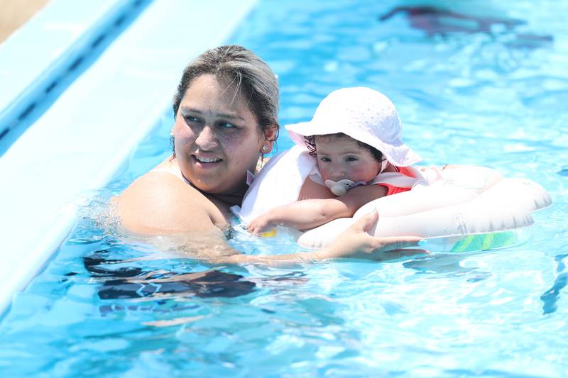 Peria Cervantes takes her 1-year old daughter, Brianna Tinico, for a dip at the Ottawa Street Pool in Plainfield. Tuesday, June 14, 2022 in Plainfield.