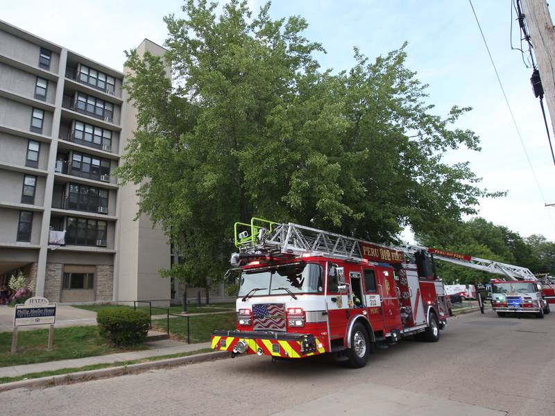 Photos: Fire departments respond to fire at Peru high-rise