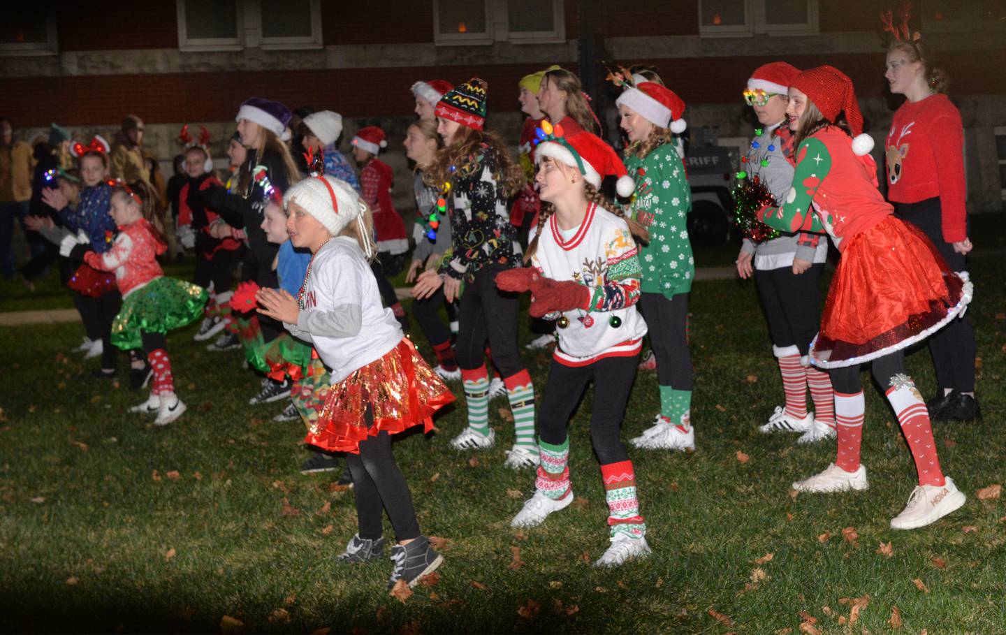 The Byron Dance Academy performed on the Ogle County Courthouse lawn during the tree lighting ceremony at Oregon's Candlelight Walk on Saturday, Nov. 25, 2023.. The evening event included Christmas music, shopping specials, kids activities, horsedrawn wagon rides and visits with Santa.