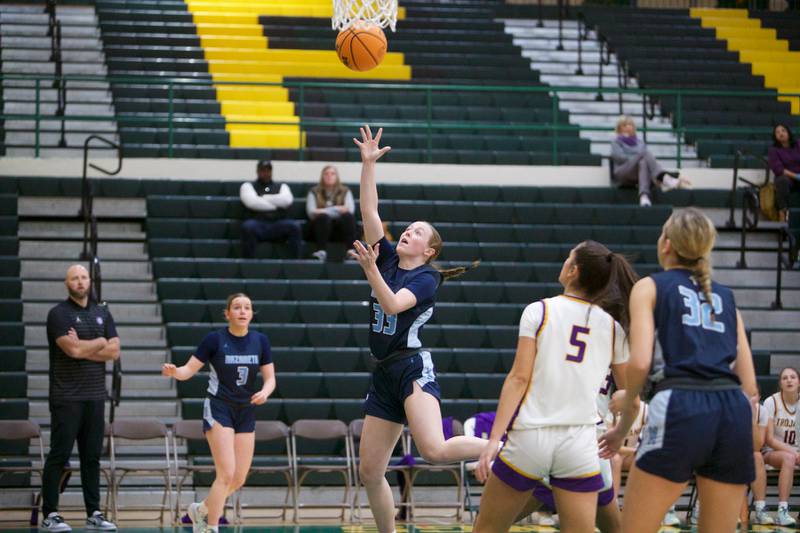 Nazareth's Molly Monroe goes in for the layup against Downers Grove North during the Dave Yates Chicagoland Showcase on Saturday, Dec7,2024 at Fremd in Palatine.