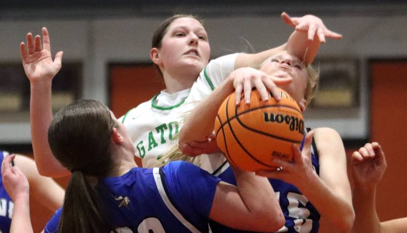 Crystal Lake South’s Gaby Dzik, left, guards Geneva’s Emma Peterson under the hoop in girls IHSA Class 3A Sectional Championship basketball on Thursday, Feb. 26, 2026, at Crystal Lake Central High School in Crystal Lake.