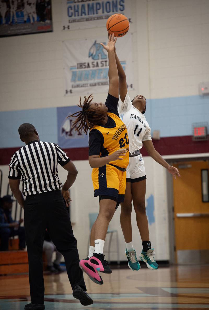 Kankakee's Shania Johnson and Thorwood's Joshlyn Williams tip off in a game on Thursday, December 11, 2025.