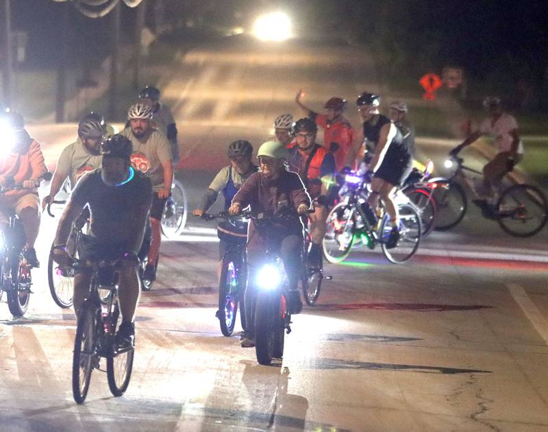 Participants begin the Raue Center for the Arts Night Owl Bike Ride in Crystal Lake on Saturday, August 2, 2025.