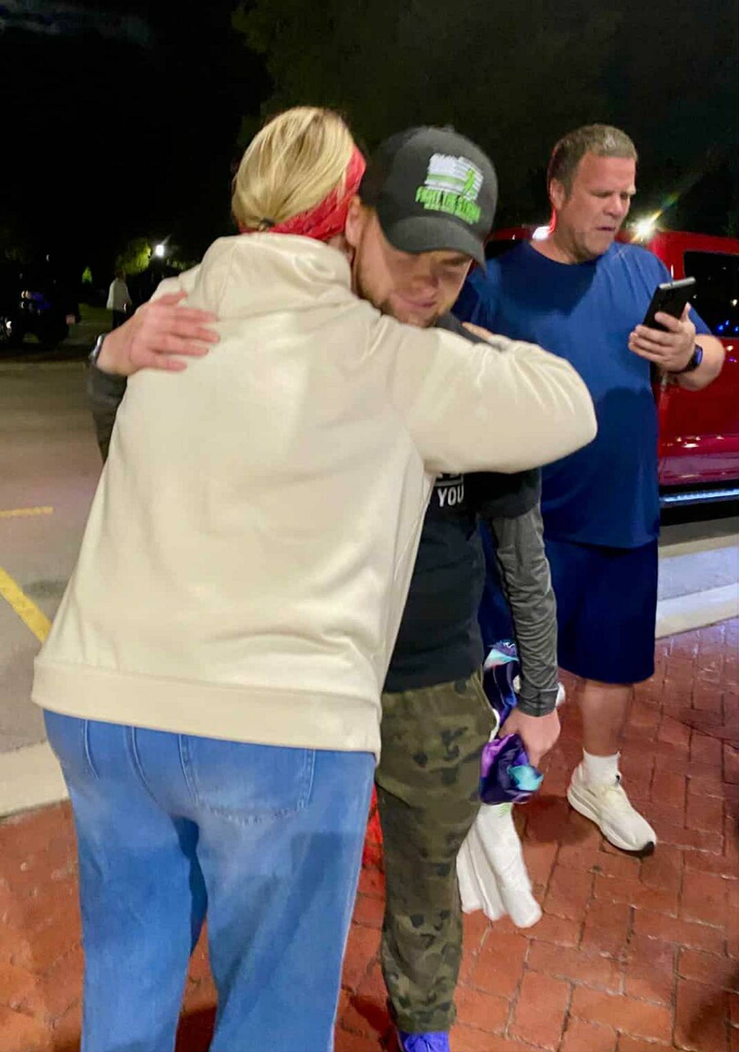 Manteno Mayor Annette LaMore hugs Jake Smith on Saturday, Sept. 6, 2025, during Smith's annual walk for mental health awareness through the streets of Manteno.