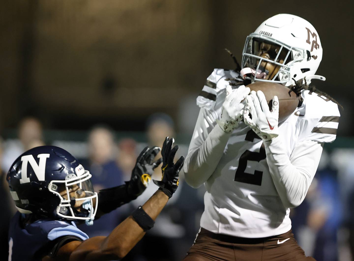 Mt. Carmel's Tavares Harrington (2) makes an interception during the varsity football game between Mt. Carmel high school and Nazareth Academy on Friday, Sept. 12, 2025 in La Grange Park, IL.