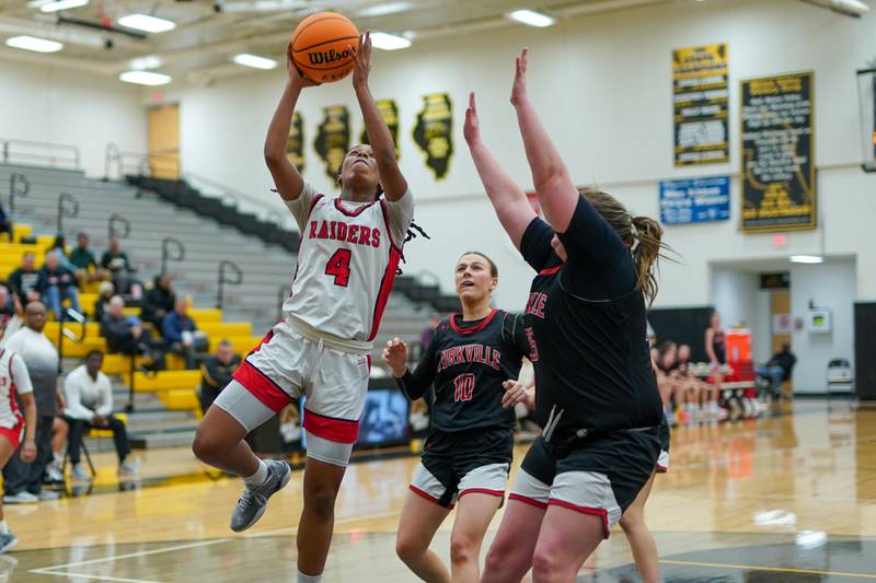 Bolingbrook's Sydney Dodd (4) powers her way to the basket against Yorkville's Madison Spychalski (35) during a Class 4A Metea Valley Regional final basketball game at Metea Valley High School in Aurora on Friday, Feb. 21, 2025.