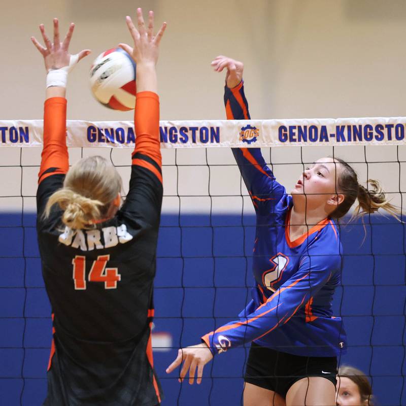 Genoa-Kingston's Ava Hardy tries to spike the ball by DeKalb's Isabelle Smith Wednesday, Sept. 11, 2024, during their game at Genoa-Kingston High School.