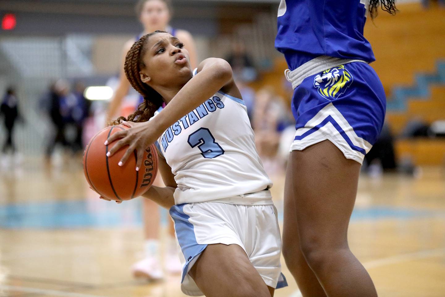 Downers Grove South's Jakylah Thomas maintains possession under Lyons Township's Nora Ezike’s defense during the West Suburban Conference championship game on Thursday, Feb. 13, 2025 at Willowbrook High School.