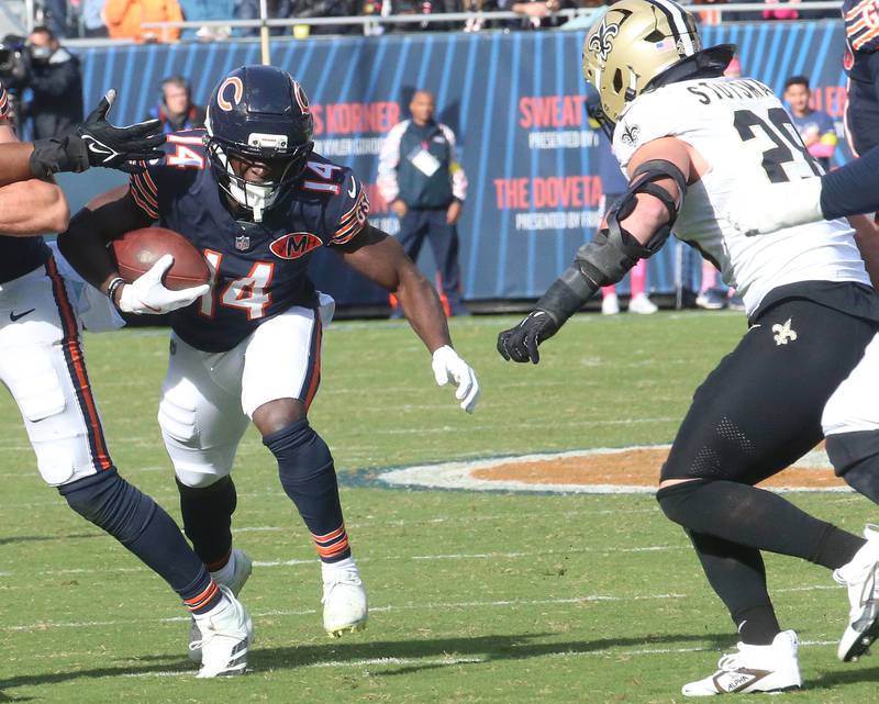 Chicago Bears wide receiver Olamide Zaccheaus runs with the ball as New Orleans Saints corner back Quincy Riley defends on Sunday, Oct .11, 2025 at Soldier Field in Chicago.