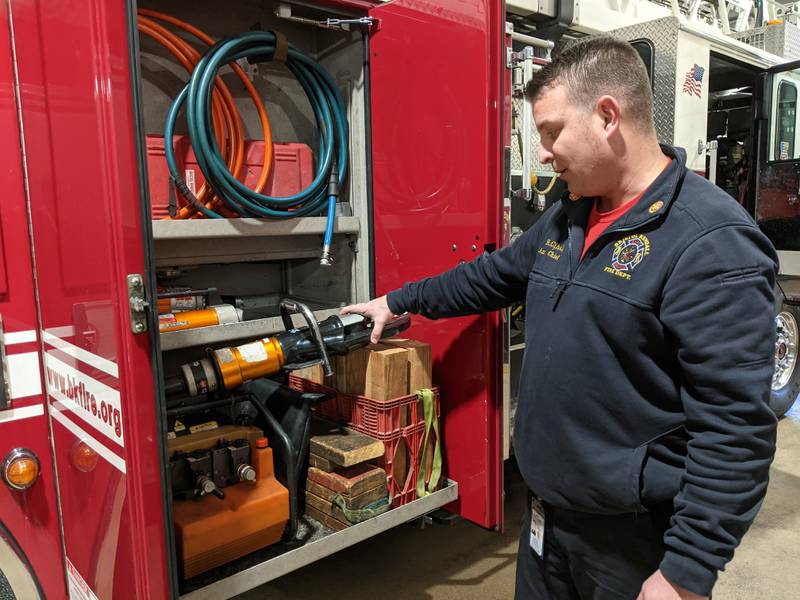 Bristol Kendall Fire Protection District Assistant Chief of Training and Safety Ryan Cihak shows some of the extrication tools on one of the department's fire trucks.