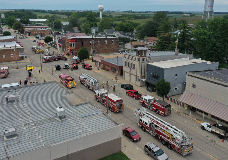 Firetrucks fill Route 89 as the respond to a structure fire at 201 North Main Street on Monday, Aug. 14, 2023 in Ladd. The fire happened just before 7:30a.m. and was upgraded to a three-alarm fire.  Firefighters from Mendota, Ladd, Peru, La Salle, Utica, Princeton and others helped with the blaze.