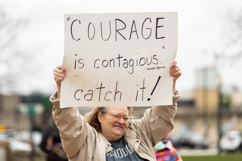 Plainfield resident Tammy Lusciatti holds up a sign at the Hands Off protest in Downtown Joliet on April 5, 2025.