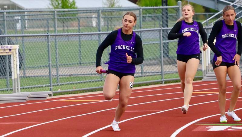 Rochelle's (left to right) Mayson Smardo, Dylan Estes and Elyse Manning run a relay during a meet held April 28 in Rochelle.