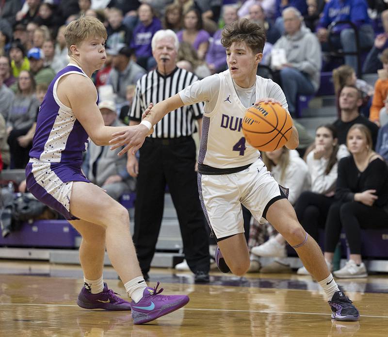 Dixon’s Brody Nicklaus drives to the hoop against Rochelle’s Carson Lewis Monday, Dec. 9, 2024, at Dixon High School.