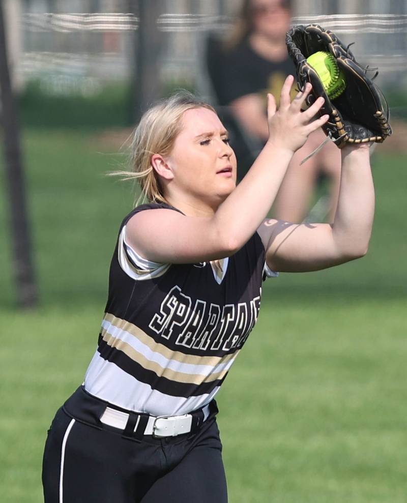 Sycamore's Addison McLaughlin catches a fly ball during their game against Dixon Thursday, May 12, 2022, at Sycamore High School.