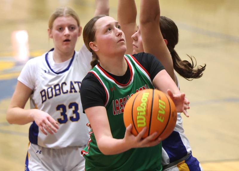 La Salle-Peru's Alexus Hines goes to the basket against a pair of Somonauk-Leland defenders during their game Thursday, Nov. 20, 2025, in the Tim Humes Breakout girls basketball tournament at Somonauk High School.