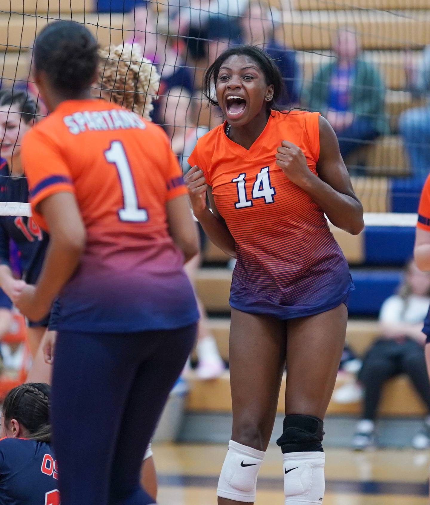 Romeoville's Demi Cole (14) reacts after scoring a point against Oswego during a volleyball game at Oswego High School on Tuesday, Oct. 17, 2023.