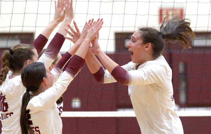 Prairie Ridge’s Maizy Agnello and the Wolves celebrate a win over Hampshire during varsity volleyball on Thursday, Oct. 3, 2024, at Prairie Ridge High School in Crystal Lake.