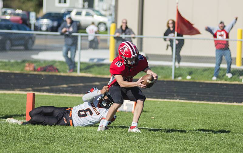 Amboy's Caden Wittenauer scores a touchdown with no time left on the clock at the end of the first half to put the Clippers up 14-6 over Milledgeville on Saturday, Nov. 6, 2021.