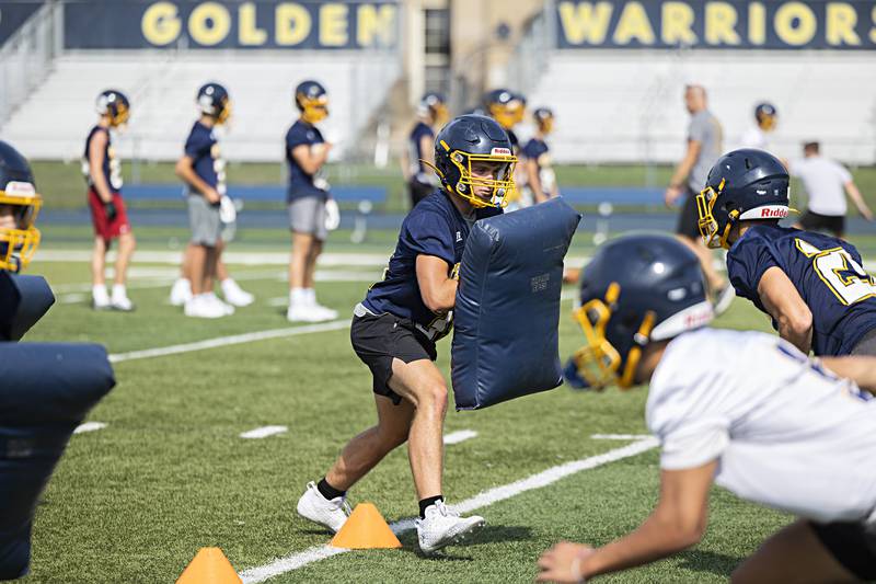 Sterling players run through drills during first day of football practice Monday, August 7, 2023.