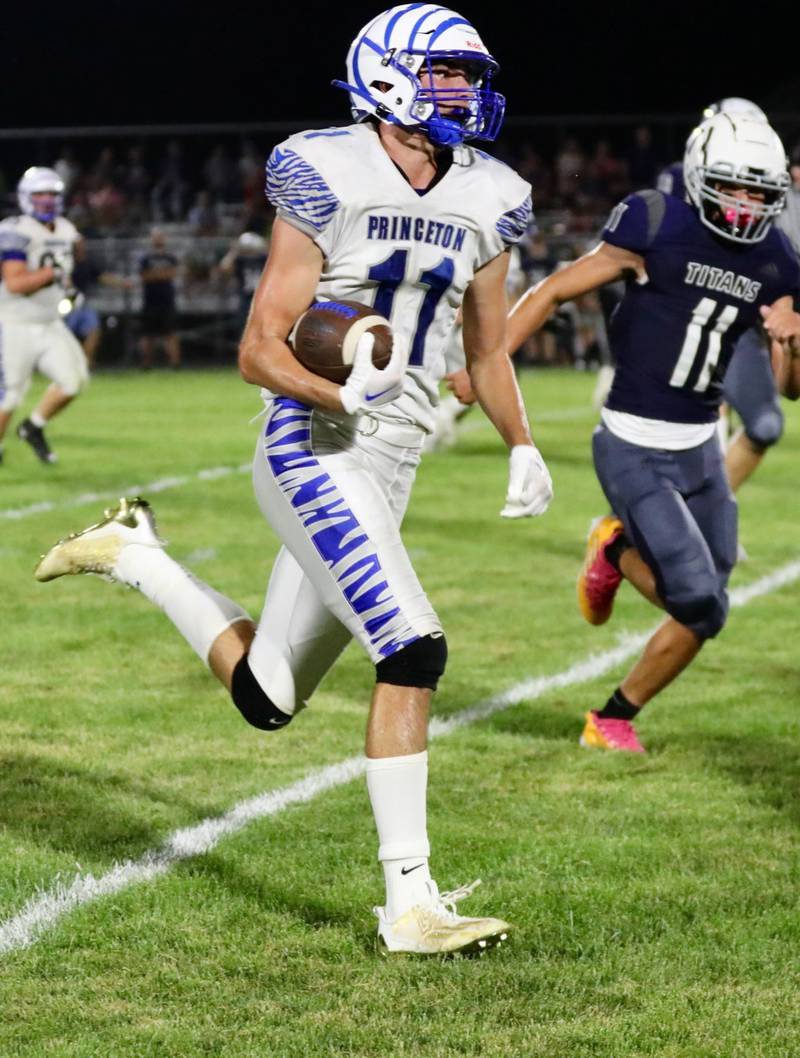 Princeton's Noah LaPorte races down the sidelines for a touchdown at Monmouth-Roseville Friday night. Princeton won 40-0.