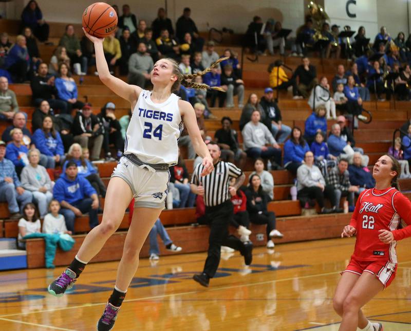 Princeton's Kaighley Davis runs in all alone to score on a layup over Hall's Kennedy Wozniak in the Princeton Holiday Girls Basketball Tournament on Friday, Nov. 23, 2024 at Princeton High School.