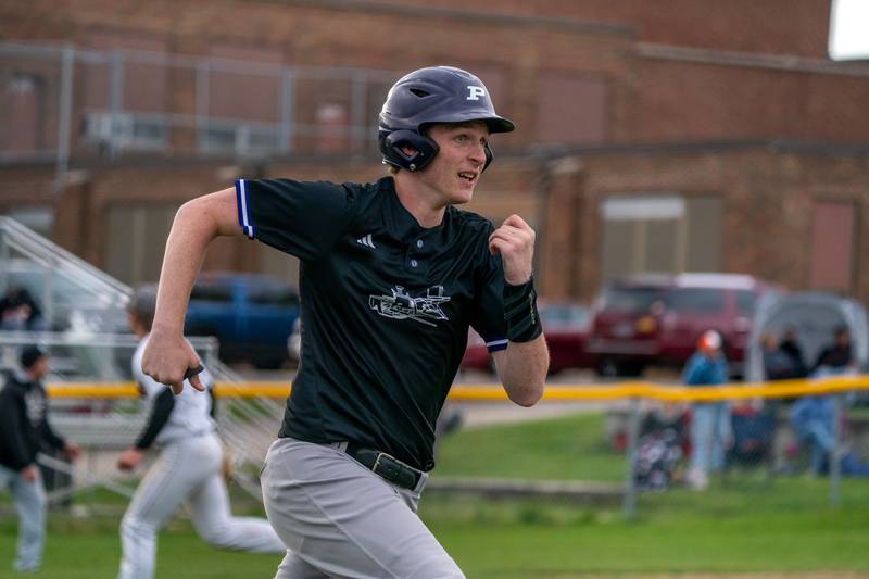 Plano’s Dillan Johnson (22) singles driving in two runs against Sandwich during a baseball game at Sandwich High School on Monday, May 1, 2023.