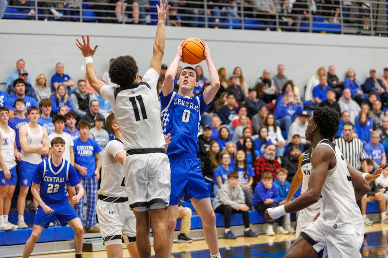 Burlington Central's Patrick Magan hangs a number against Kaneland at the Class 3A Burlington Central Regional Final on Friday, Feb. 27,2026 in Burlington.