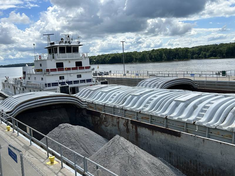The towboat Neil N Diehl pushes barges through the lock at Lock & Dam 13 as it heads north on the Mississippi River near Fulton on Sunday, July 6, 2025. One of the barges was hauling rock headed to St. Paul, Minnesota.