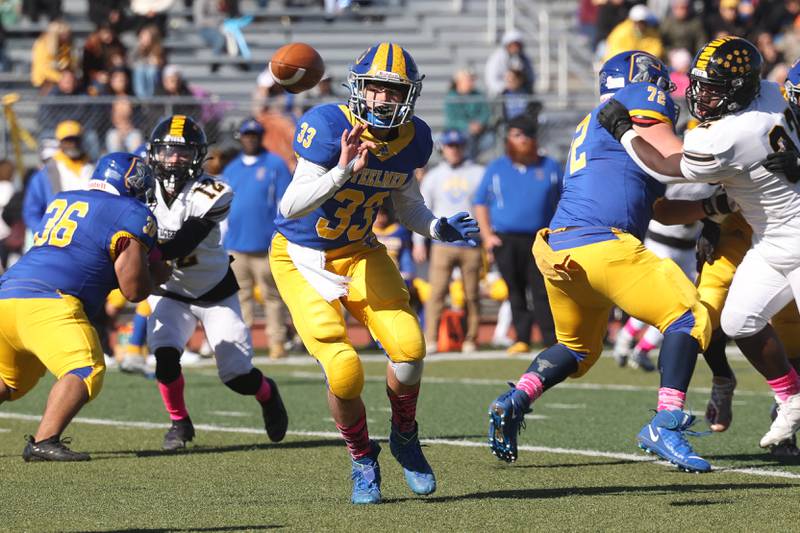 Joliet Central’s Paul Slick flips the ball against Joliet West in the cross town rival matchup on Saturday.