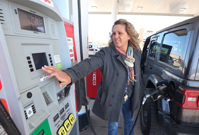 Paula Pinne, from Sycamore, fills up her vehicle Tuesday, March 8, 2022, at the Hy-Vee in Sycamore. US gas prices hit an all time high on Monday with local stations charging between $4.50 and $5.00 for a gallon of regular unleaded gasoline.