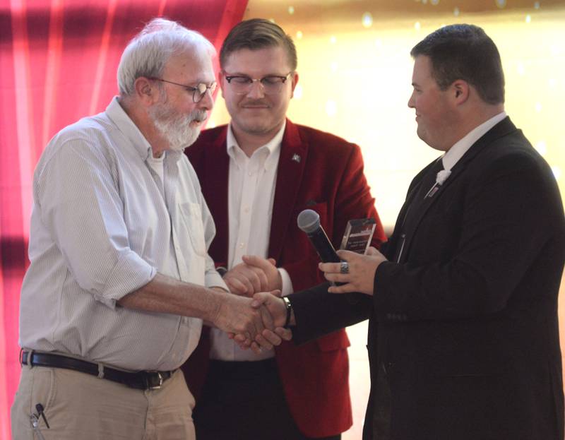 Oregon Area Chamber of Commerce Volunteer of the Year Dave Head (left) receives his award from Chamber Executive Director Chance Munroe (center) and Tyler Mowry, Chamber member, at the annual awards dinner on Thursday, Aug. 15, 2024, at River's Edge Experience, Oregon.