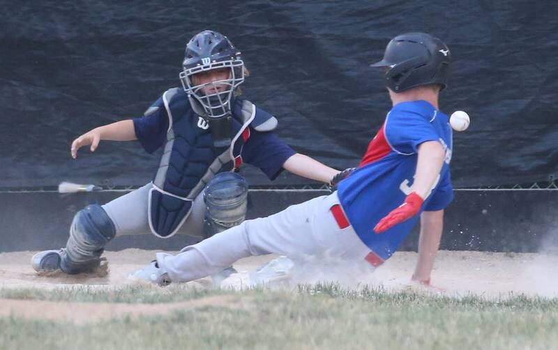 Thrush Sanatation Red Sox's catcher Joseph Husted misses a tag on Frostbyte MSP Ranger's Tucker Johnson in the Ottawa Little League baseball (12U) City Championship on Friday, June 23, 2023 at Varland Park in Ottawa.